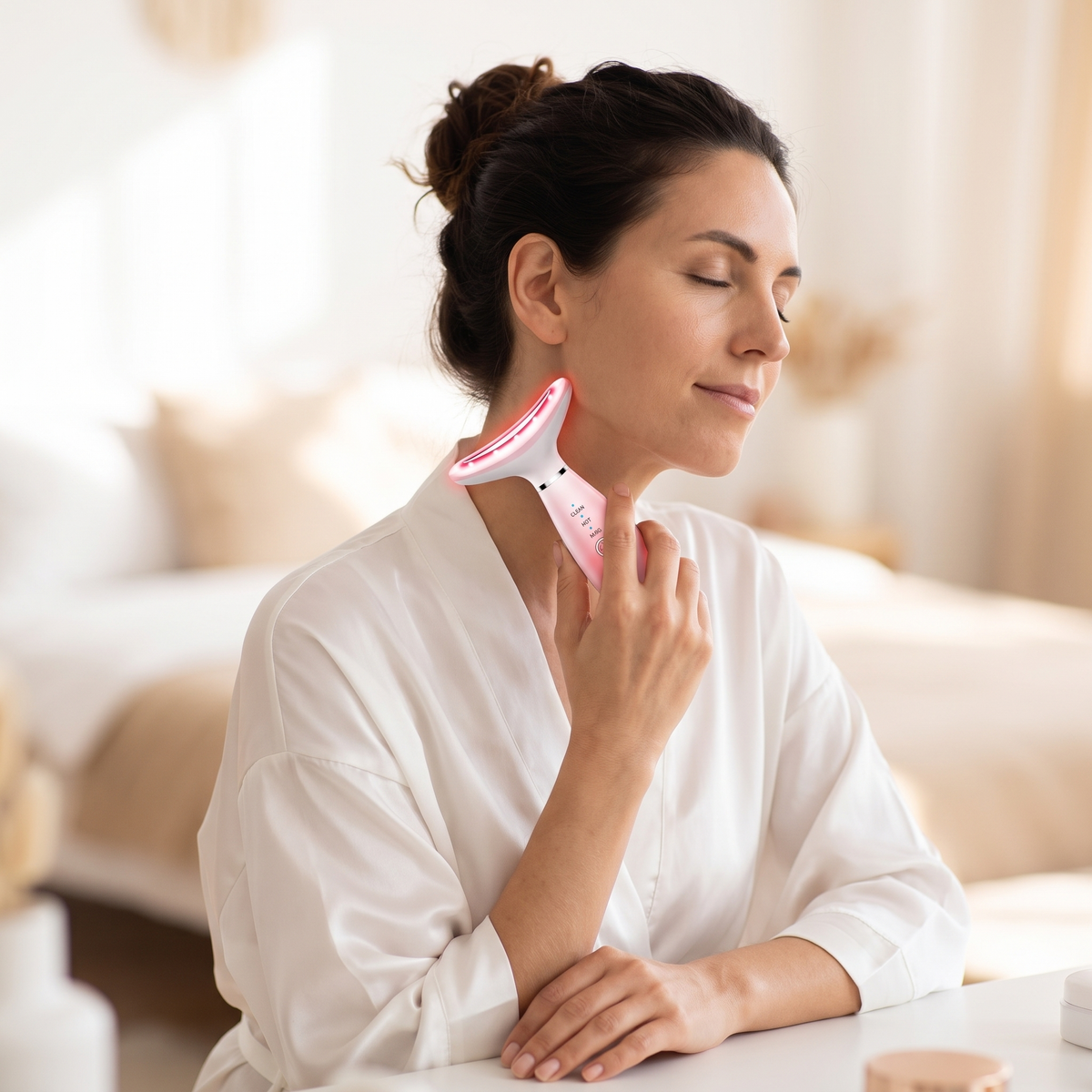 Woman using the Himra neck and face massager on her neck