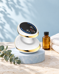 Himra cupping massager on a blue stone plinth with massage oil and eucalyptus