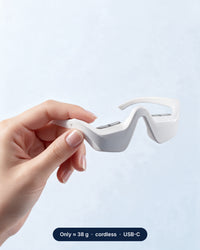 Hand holding the lightweight Himra red light eye glasses