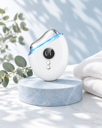 The gua sha with blue light on a stone stand