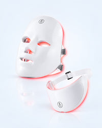 Himra LED face mask and neck piece glowing soft red on a light blue background